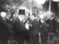 Mussolini  ripreso di profilo in piedi, di fronte ...