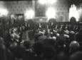 Mussolini legge una relazione all'interno della sa ...