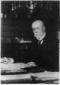 Toms Masaryk seduto ad una scrivania. P ...