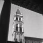 Il campanile di una chiesa visto da una finestra,  ...