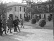 Mussolini, accompagnato da alti gradi della milizi ...