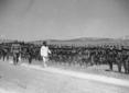 Mussolini, accompagnato da autorit in uniforme de ...
