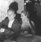 Eduardo De Filippo  seduto a un tavolo, accanto l ...